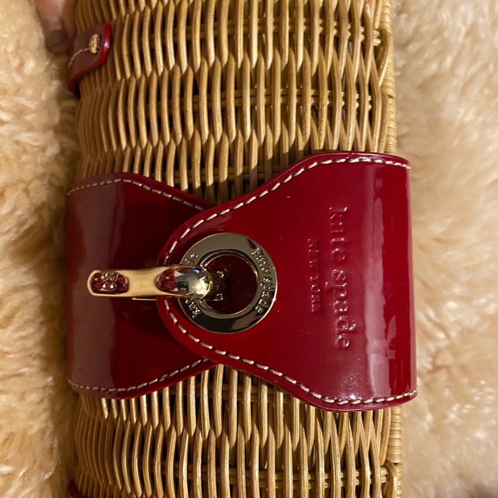 Kate Spate clutch bag red leather and rattan.